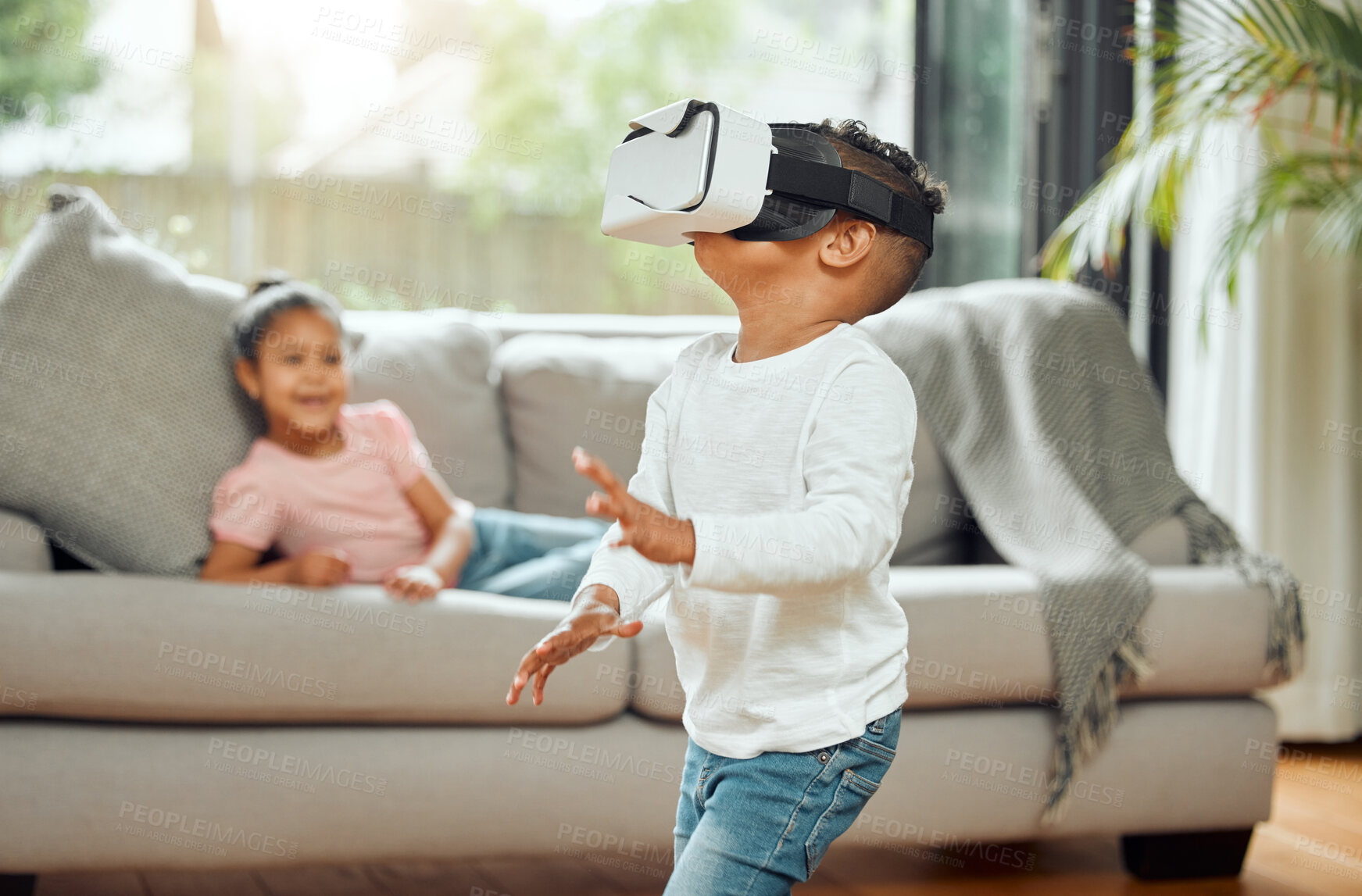 Buy stock photo Young boy with VR goggles, gaming and metaverse with futuristic tech, child experience simulation at family home. Male kid in living room with video games, virtual reality and future technology