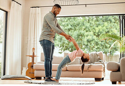 Buy stock photo Shot of a father practicing a dance routine with his daughter at home