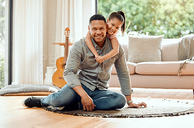 Buy stock photo Portrait of a young father and daughter bonding together at home