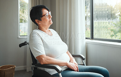 Buy stock photo Shot of an elderly woman enjoying the view from her window