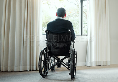 Buy stock photo Rearview shot of an elderly man enjoying the view from his window