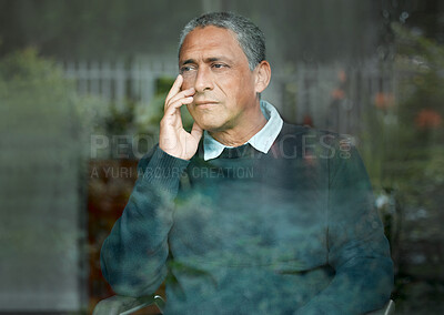 Buy stock photo Shot of an elderly man enjoying the view from his window