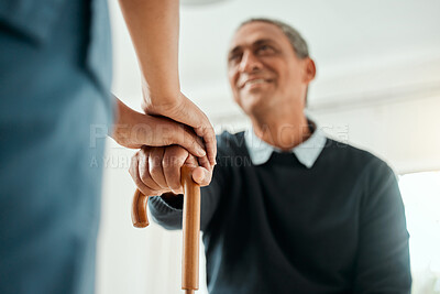 Buy stock photo Cropped shot of a nurse helping an older man stand up and use his walking stick