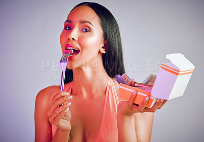 Buy stock photo Woman, portrait and bite lipstick in studio, eating cosmetics and playful on gray background. Female person, beauty and makeup for nutrition in aesthetic, eating skincare and container for product