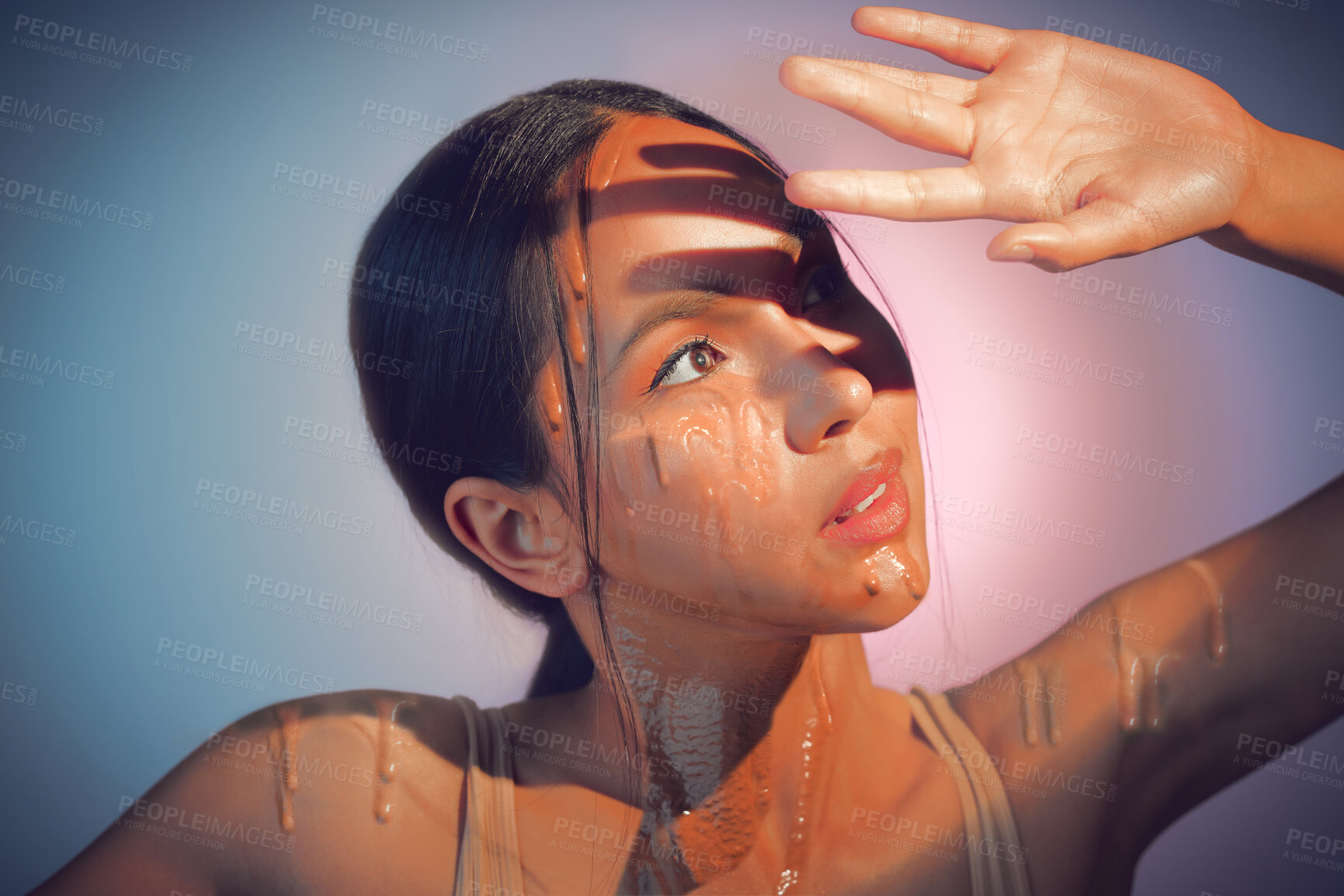 Buy stock photo Woman, hand and liquid drip in studio, cosmetic foundation and sunscreen protection on gray background. Female person, skincare and tint in moisturizer for healthy glow, makeup treatment and spf