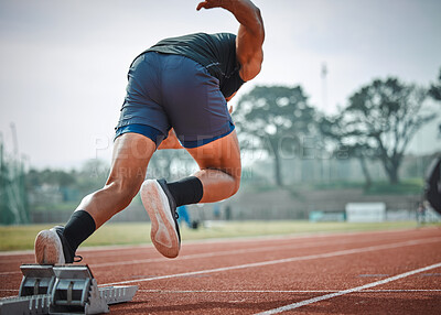 Buy stock photo Stadium, man running and start block of athlete on a runner and arena track for sprint race training. Back, run and sports exercise of male person in marathon for fitness and workout outdoor on field