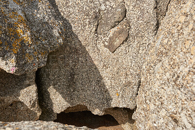 Buy stock photo Small crevice or gully formed by the erosion of sea water. Large boulders or sandstones on beach shore or in the mountains.Texture detail of sedimentary rock acting as wave breaker on coastal seaside