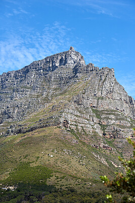 Buy stock photo Copy space landscape of Table Mountain in a serene nature reserve and environmental national park with green trees and plants. Rough hiking terrain, blue sky and copyspace in Cape Town, South Africa