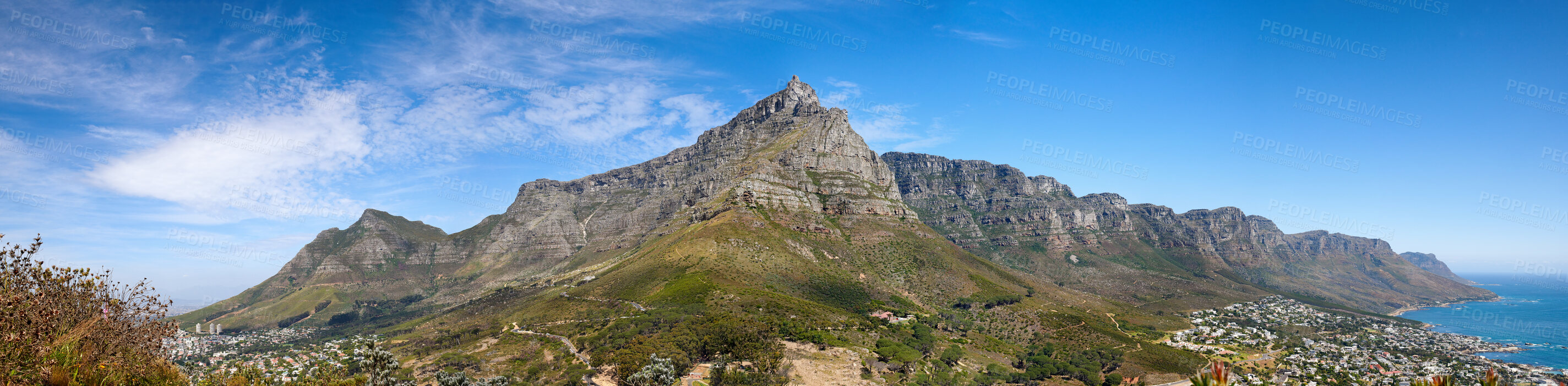 Buy stock photo Beautiful Table Mountain with lush greenery and nearby urban city in a wide angle landscape in summer. Scenic view of the nature in South Africas popular National landmark natural tourist destination