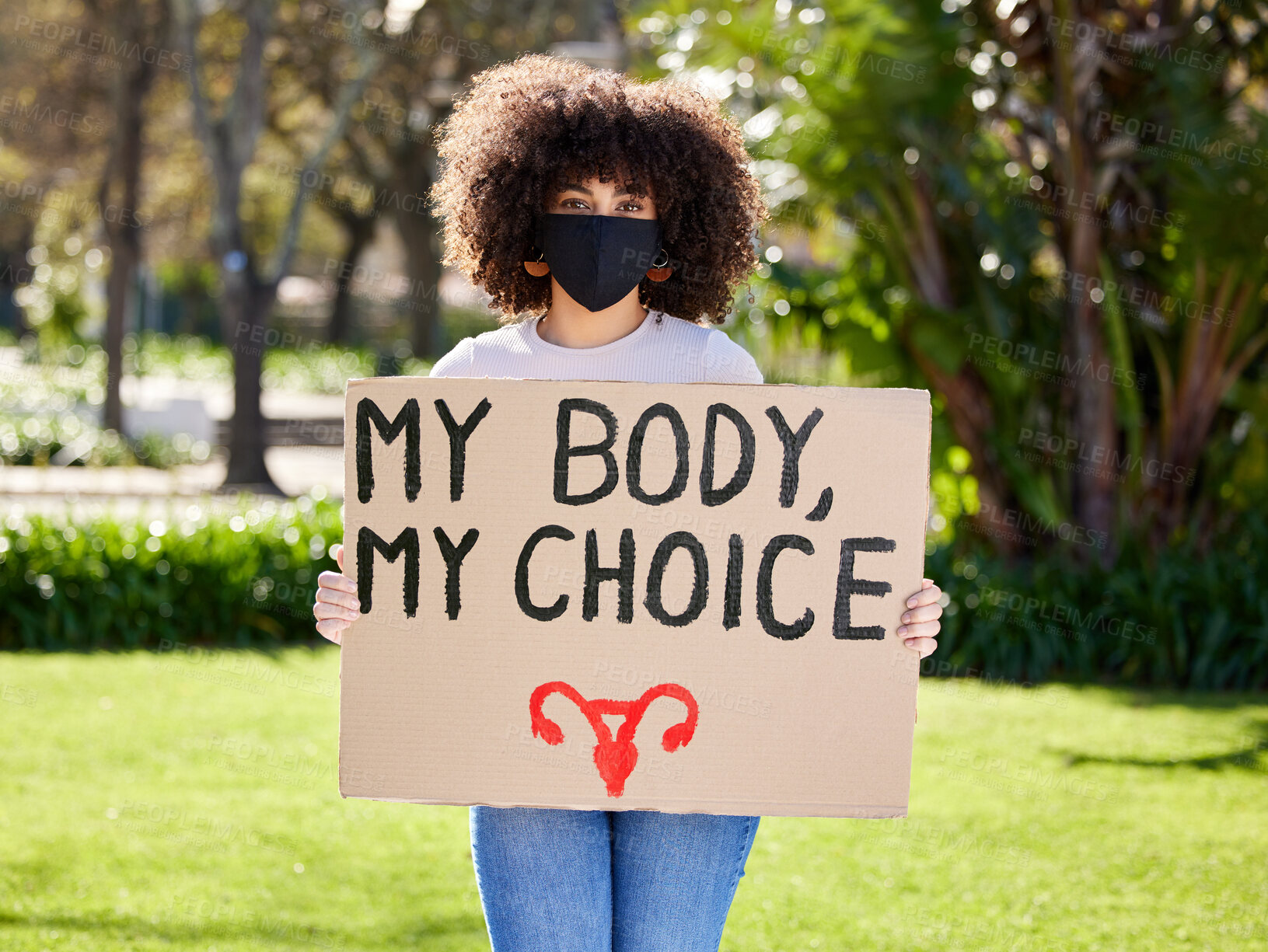 Buy stock photo Woman, portrait and cardboard for outdoor protest on abortion, body choice or freedom of human rights. Feminism, poster and female person with mask for equality, political change or safe decision