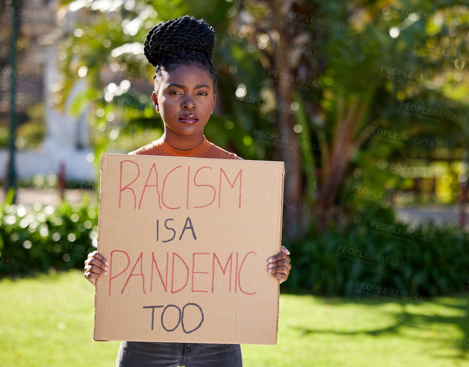 Buy stock photo Portrait, social justice and activist as African girl with placard, outdoor and human rights for movement, strike and politics. Female person, demonstration and protest for equality on board or sign