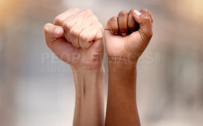 Buy stock photo Shot of two people protesting together in solidarity