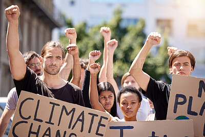 Buy stock photo Shot of a group of people protesting climate change