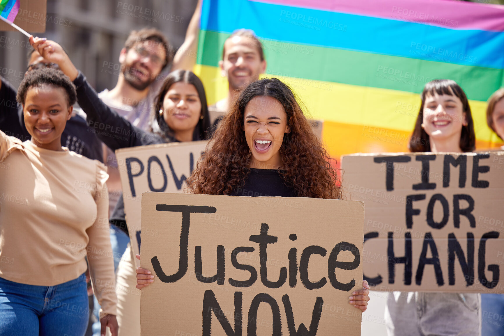 Buy stock photo Shot of a group of young people protesting for lgbtq rights