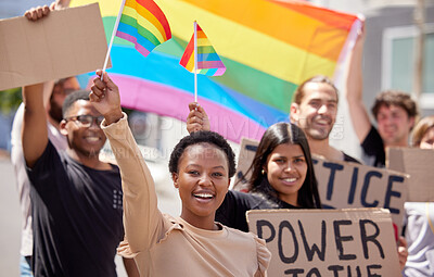 Buy stock photo Shot of a group of young people protesting for lgbtq rights