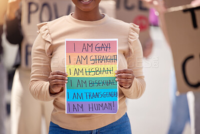 Buy stock photo Protest, lgbtq and woman with poster, support and walking in street, paper or activism for human rights. social gathering, person or crowd with board, queer people or pride with community for freedom