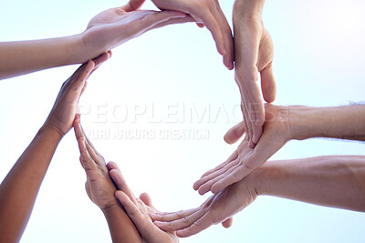Buy stock photo Shot of a group of people creating a circular form with their hands together