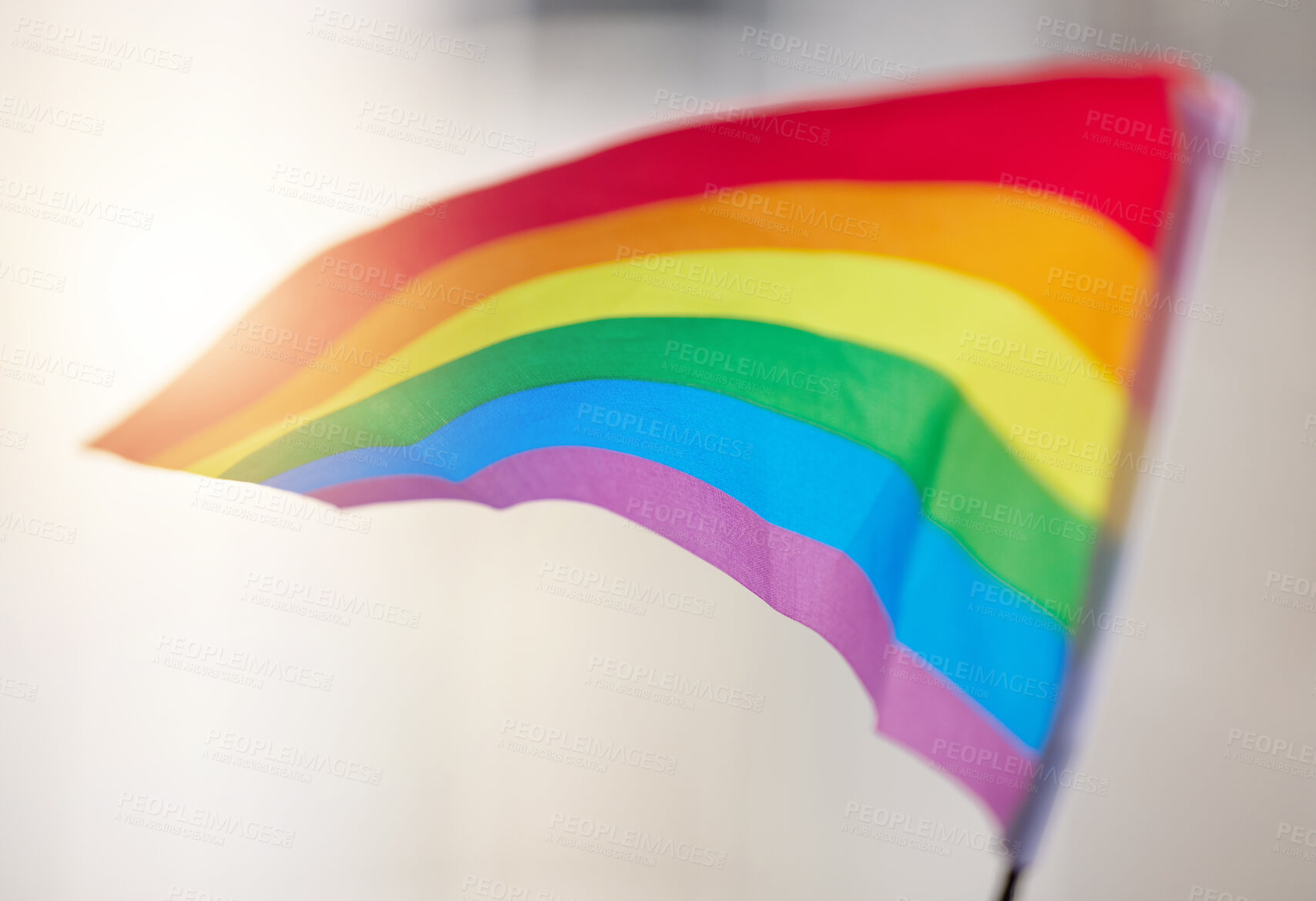 Buy stock photo Lgbtq, rainbow flag and freedom of sexuality for support, social protest and human rights in studio. Gay banner, symbol and icon waving in wind for pride, equality and choice on white background