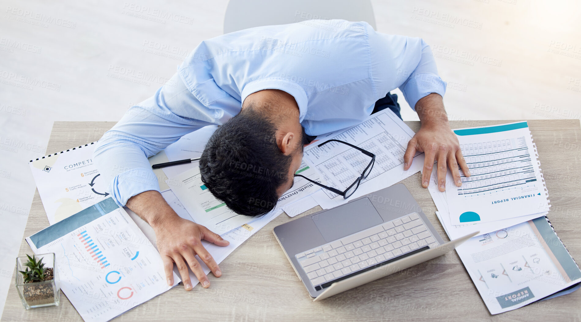 Buy stock photo Businessman, tired and sleeping at desk in office with burnout risk, overworked and nap for low energy. workplace, exhausted or fatigue of asleep male accountant, finance documents or laptop on table