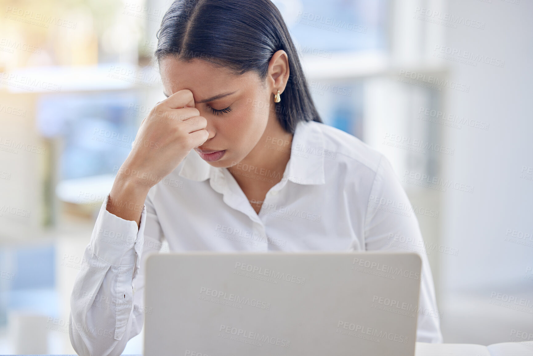 Buy stock photo Headache, woman and stress in office for deadline, debt and overworked in workplace. Female lawyer, frustrated and laptop at desk with anxiety, burnout and tired from workload, pressure and work