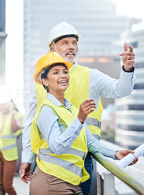 Buy stock photo Shot of two businesspeople working together at a construction site