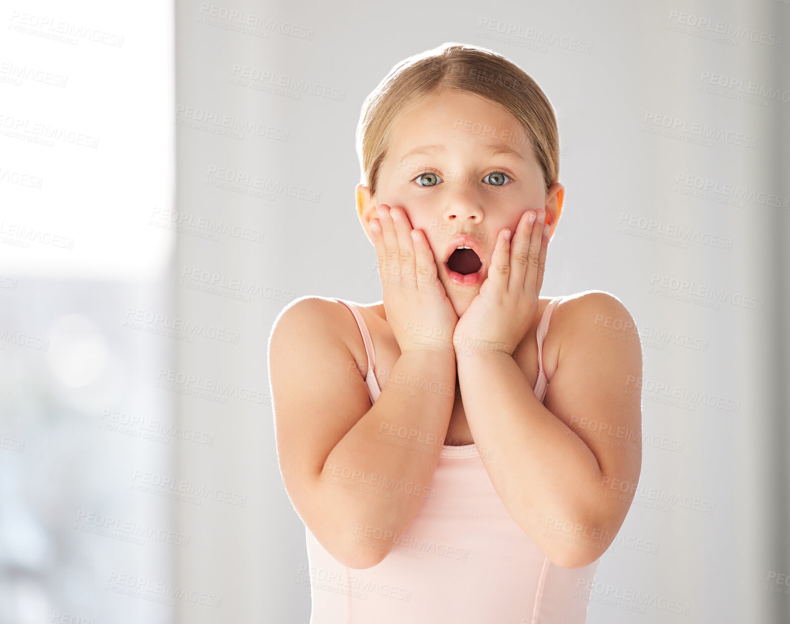 Buy stock photo Shot of a little girl looking shocked in a dance studio
