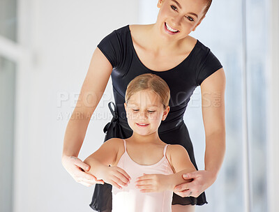 Buy stock photo Shot of a little girl practicing ballet with her teacher in a dance studio