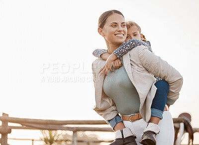 Buy stock photo Happy mother, piggyback and farm with child for fun bonding, holiday or weekend together at countryside. Mom carying daughter, little girl or kid on back in nature for outdoor walk by animal stables