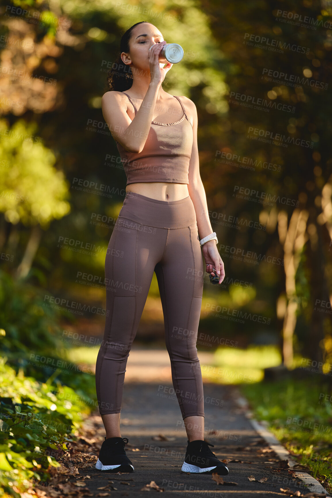 Buy stock photo Fitness, woman and drinking water in nature for rest, sustainability or healthy wellness from exercise. Calm female person, athlete or runner with drink for hydration after cardio workout in forest