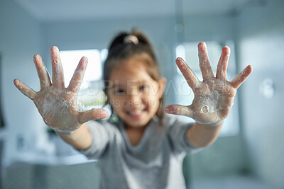 Buy stock photo Soap, girl child and washing hands with smile for healthy development, portrait and dirt removal in home. Kid, palm and foam bubbles for bacteria cleaning, learning hygiene and growth in bathroom