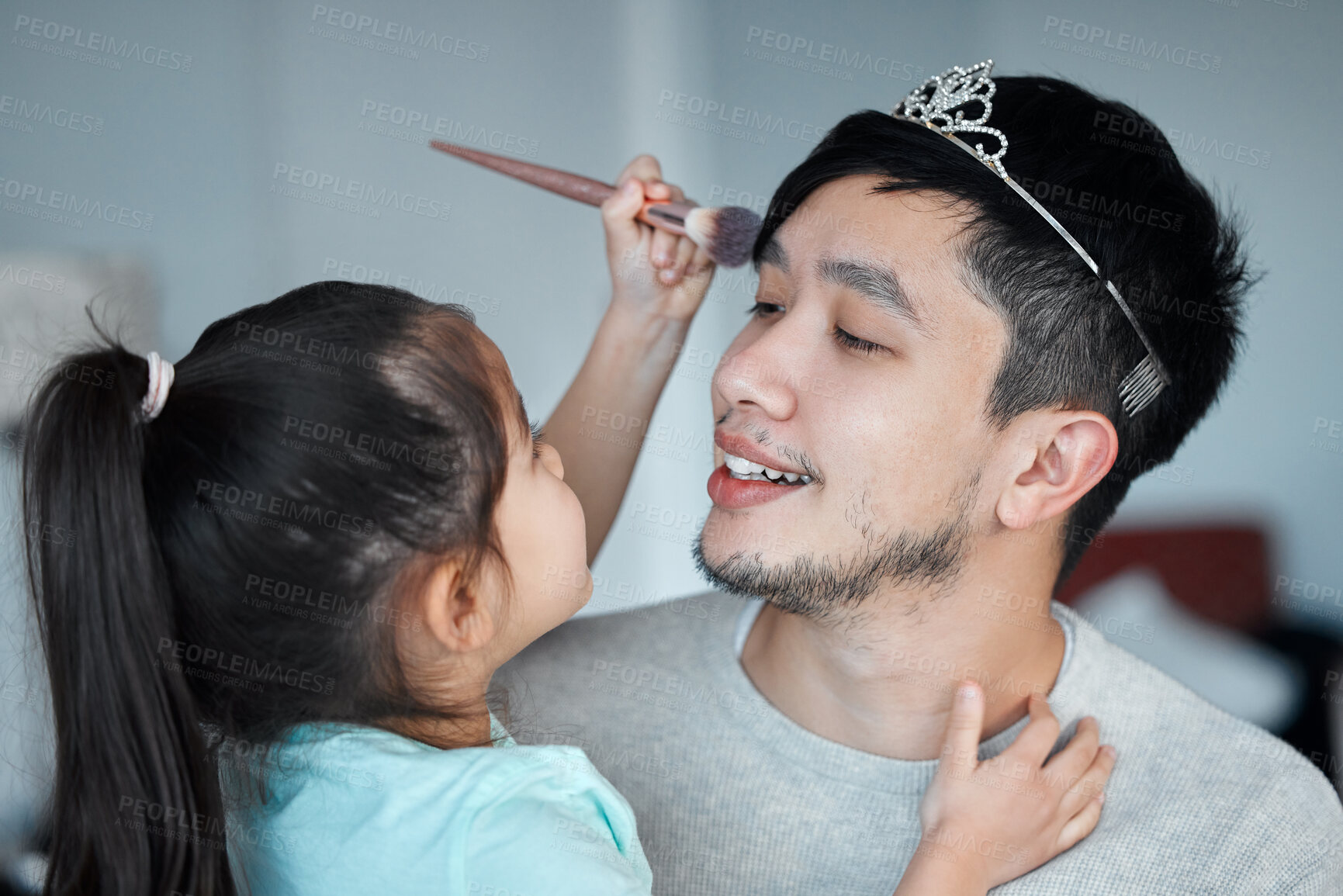 Buy stock photo Girl, dad and brush for makeup, fun and bonding together in home with powder, crown and happy father. Asian family, daughter and man in house for love, game and childhood with care, smile and funny