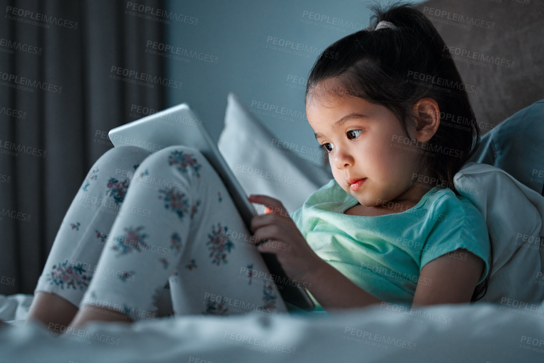 Buy stock photo Digital, tablet and child on bed at night for education, learning or language development. Online, reading and asian girl with ebook subscription for information, literacy or knowledge in home