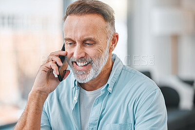 Buy stock photo Shot of a mature businessman sitting alone in his home office and using his cellphone