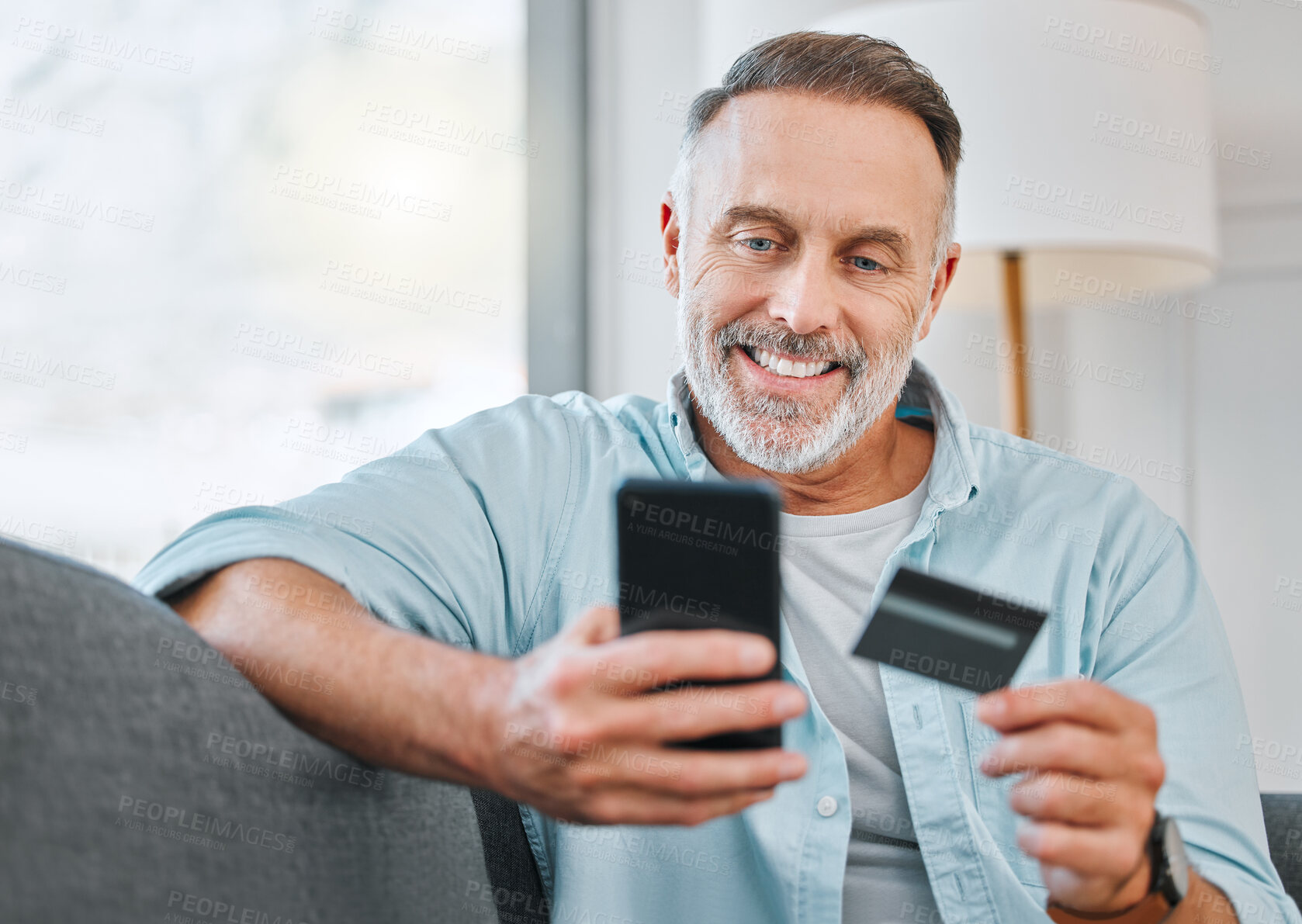 Buy stock photo Relax, mobile and mature man with credit card on sofa for transaction, e commerce or online shopping in living room. Payment, app and person for purchase, subscription or internet banking in home