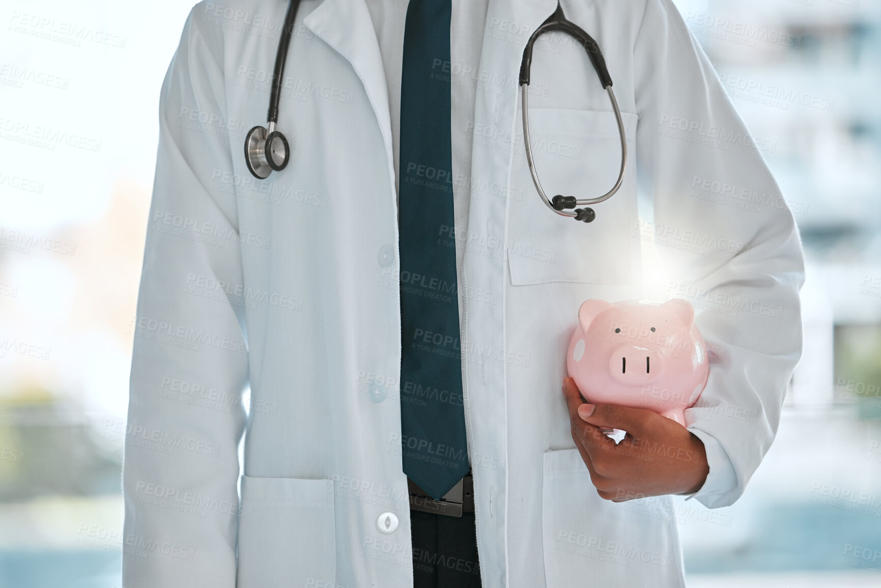 Buy stock photo Doctor, man and piggy bank for finance in hospital, investment and profit for medical budget. Male person, insurance and planning for healthcare savings, income and ecommerce for clinic funding