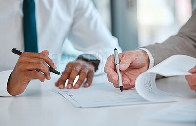 Buy stock photo Shot of two unrecognizable males signing a contract in a office