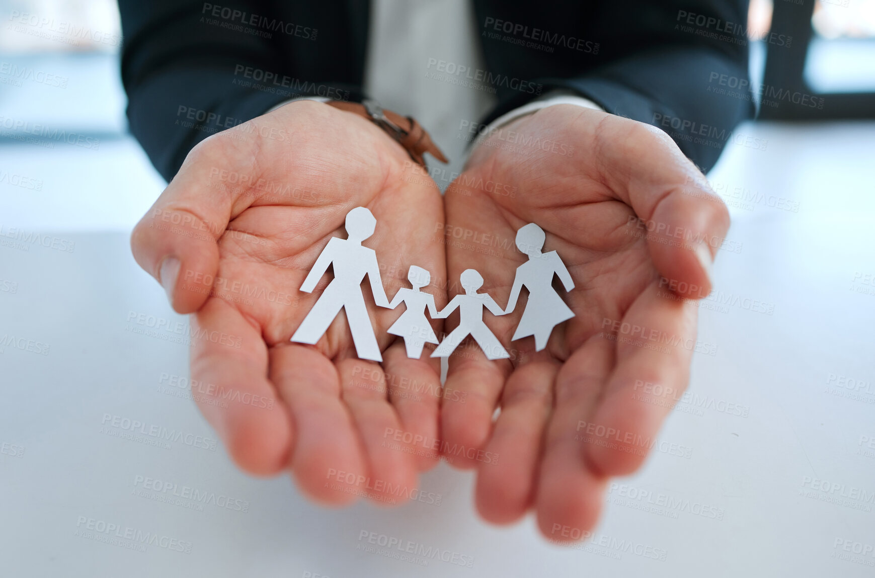 Buy stock photo Hands, paper family and businessman with insurance for security or protection for future. Trust, safety and male agent with cutout of people for life cover, investment or asset management in office.