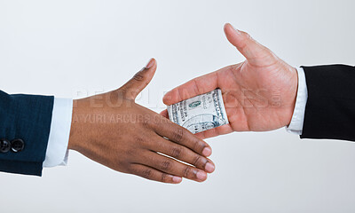 Buy stock photo Money, handshake and business people for deal in studio for theft, bribery and finance corruption. Corporate, cash and workers shaking hands for secret payment, blackmail and fraud on gray background