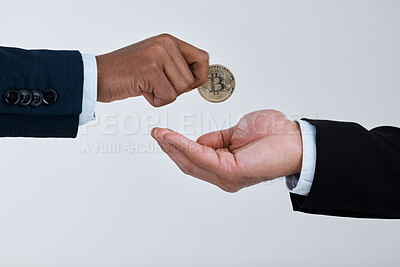 Buy stock photo Shot of a businessman taking money from another man against a grey background