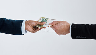 Buy stock photo Shot of a businessman taking money from another man against a grey background