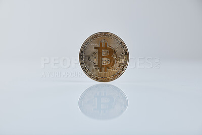 Buy stock photo Studio shot of a coin against a grey background