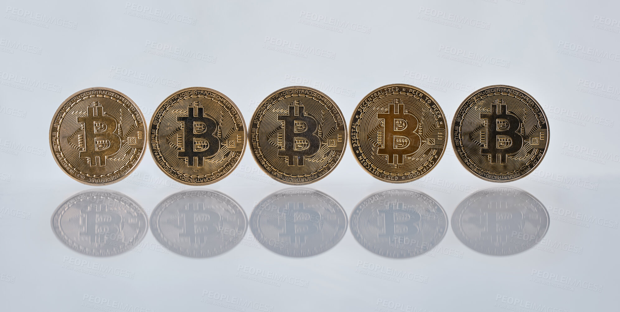 Buy stock photo Studio shot of a few coins against a grey background