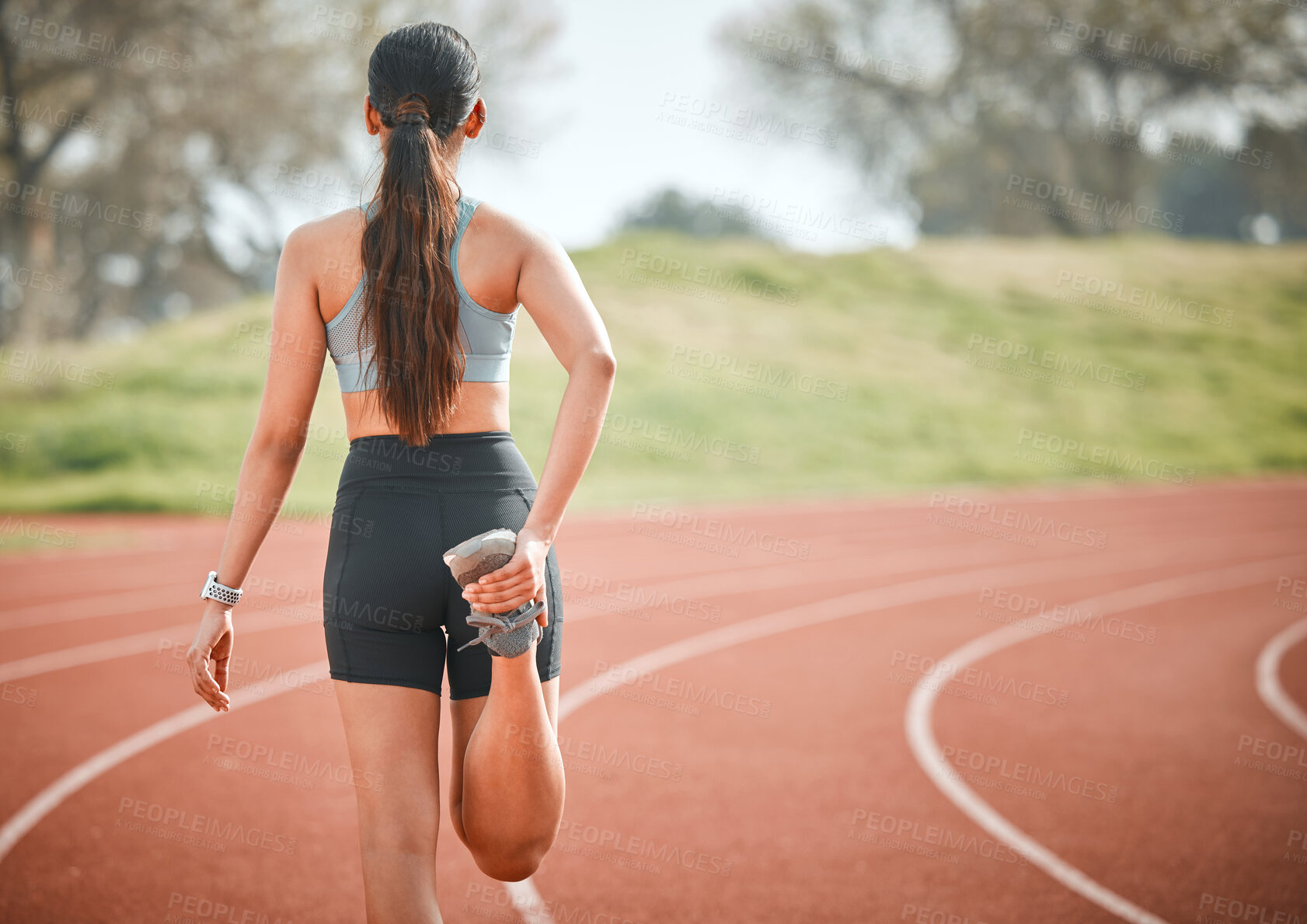 Buy stock photo Girl, stretching leg and athlete at arena, outdoor warm up and prepare for start running. Female person, back and getting ready for marathon training, flexible and muscle for sports performance