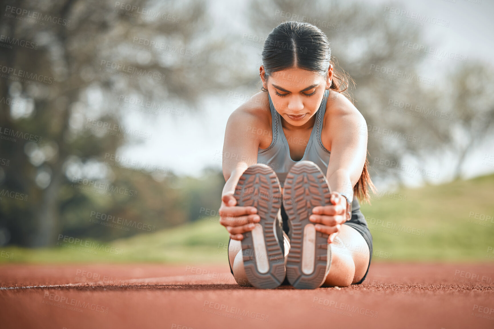 Buy stock photo Girl, stretching legs and athlete fitness on track, outdoor warm up and prepare for start of running. Female person, ground and getting ready for training, flexible and muscle for performance