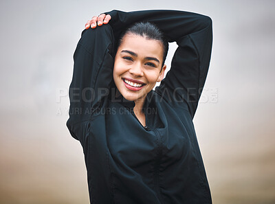Buy stock photo Cropped portrait of an attractive young female athlete warming up outside