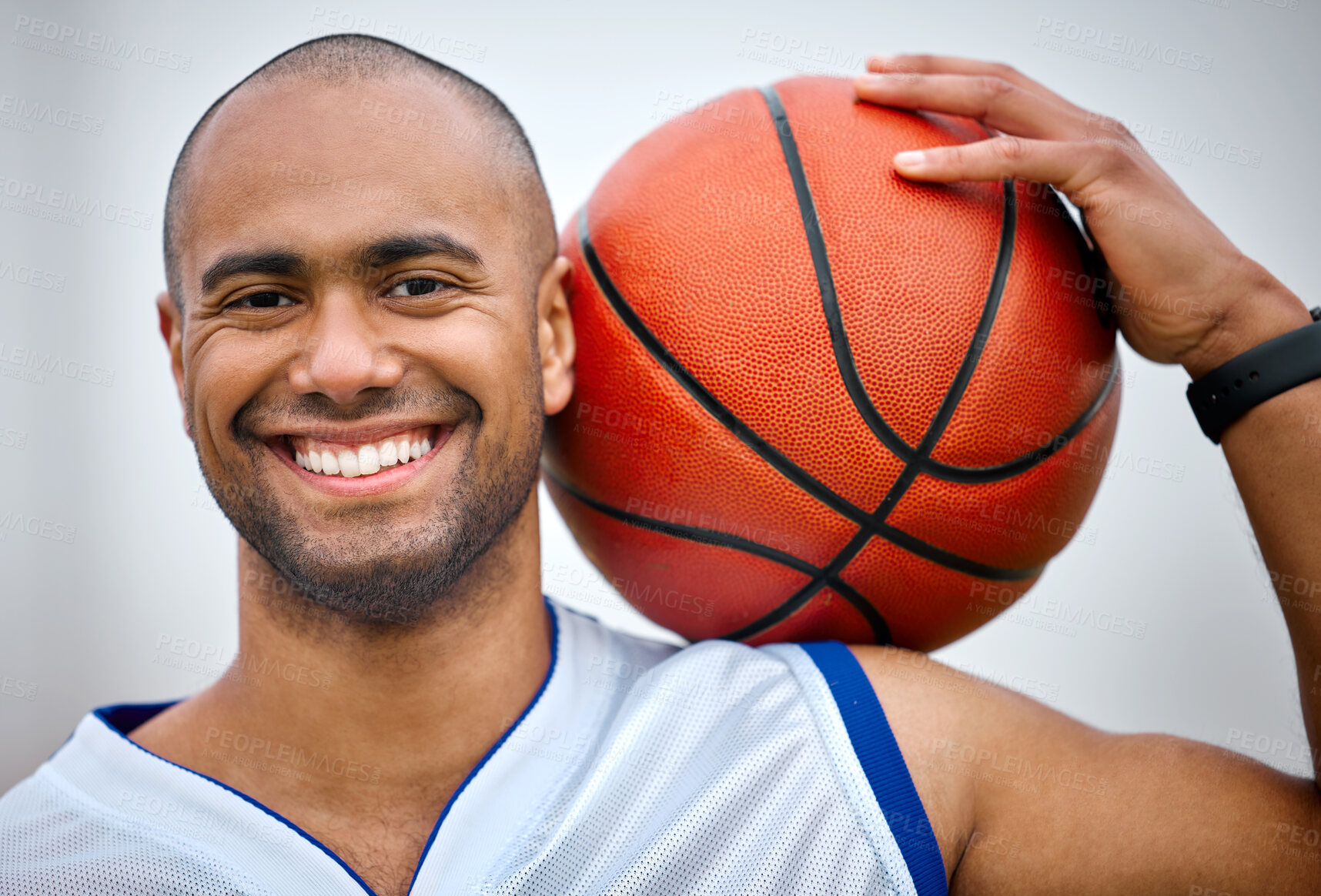 Buy stock photo Cropped portrait of a handsome young male basketball player standing outside