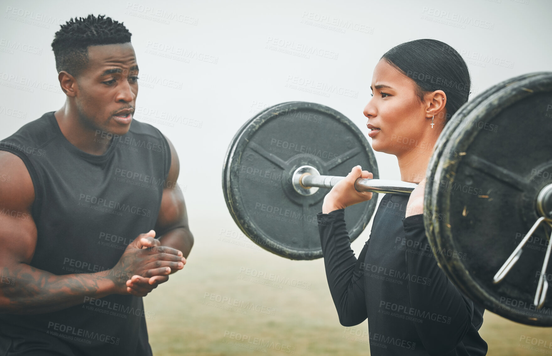 Buy stock photo Fitness, weights and coach with woman in nature for arm strength, muscles and tone. Sports, fog and male personal trainer helping female athlete with dumbbell for lifting exercise in outdoor field. 