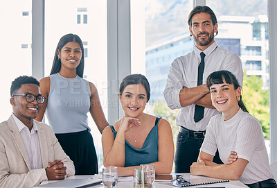 Buy stock photo Shot of a group of young business people together in their office