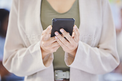 Buy stock photo Cropped shot of a businesswoman using her cellphone