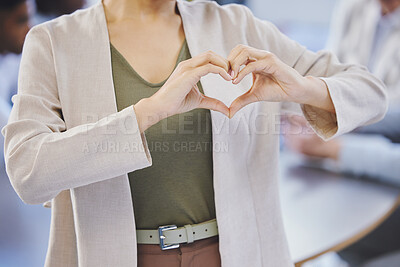 Buy stock photo Cropped shot of a businesswoman forming a heart shape with her hands